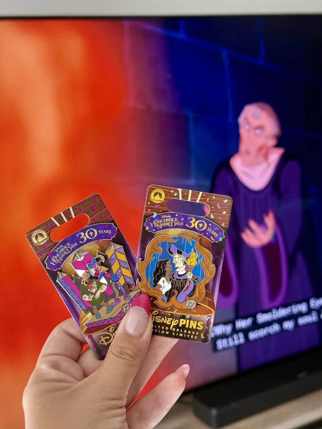 Trading cards and pins held up at the parks